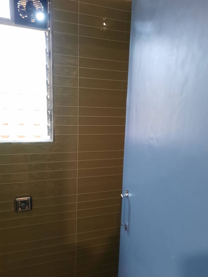 Bathroom finished in brown wall tile