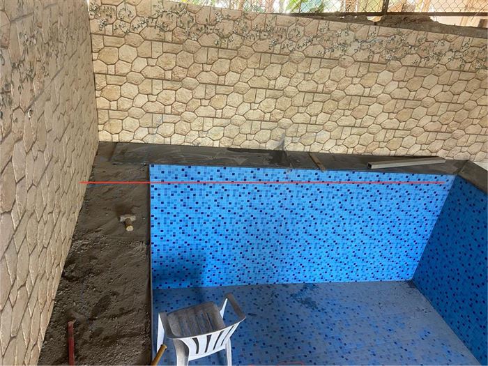 Swimming pool shell waterproofed before tiling