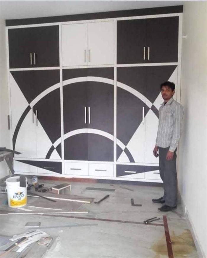 Black and white wardrobe with arched panel detail