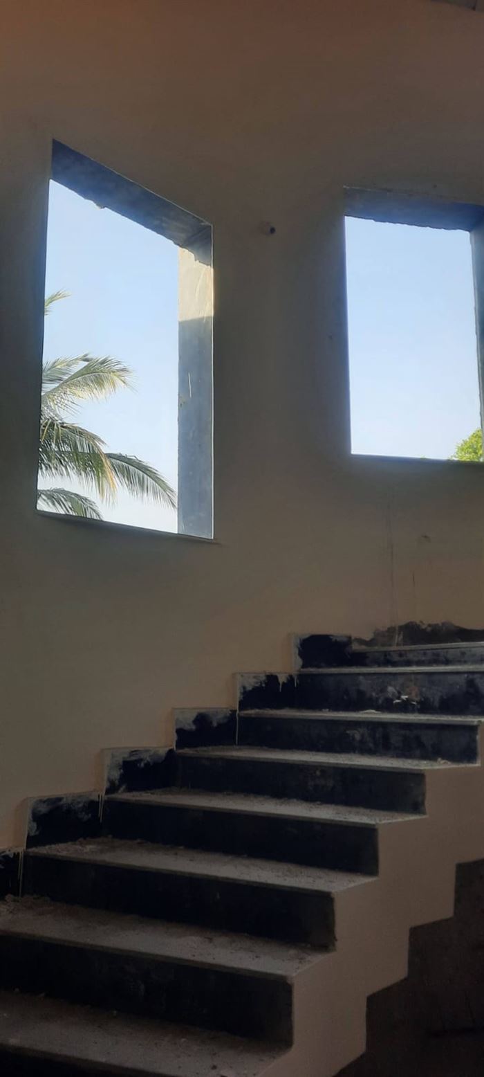 Finished staircase with dark stone treads
