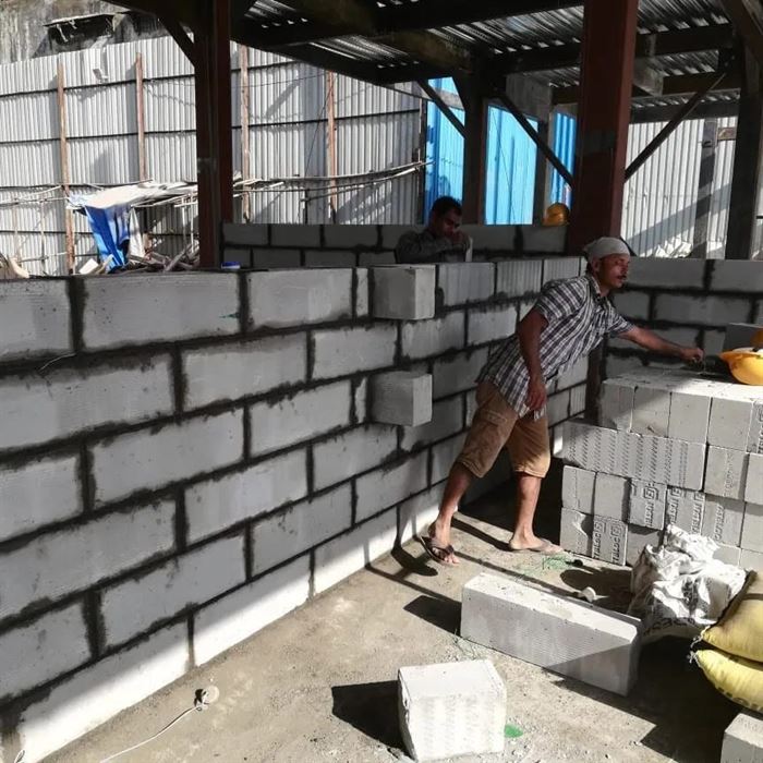 Concrete block masonry wall being built