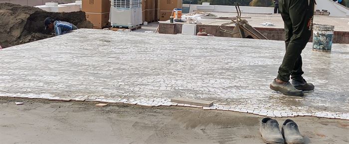 Terrace screed laid to slope