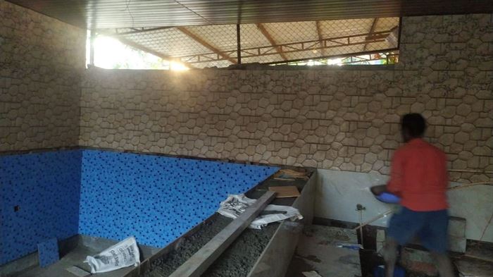 Pool shell being waterproofed